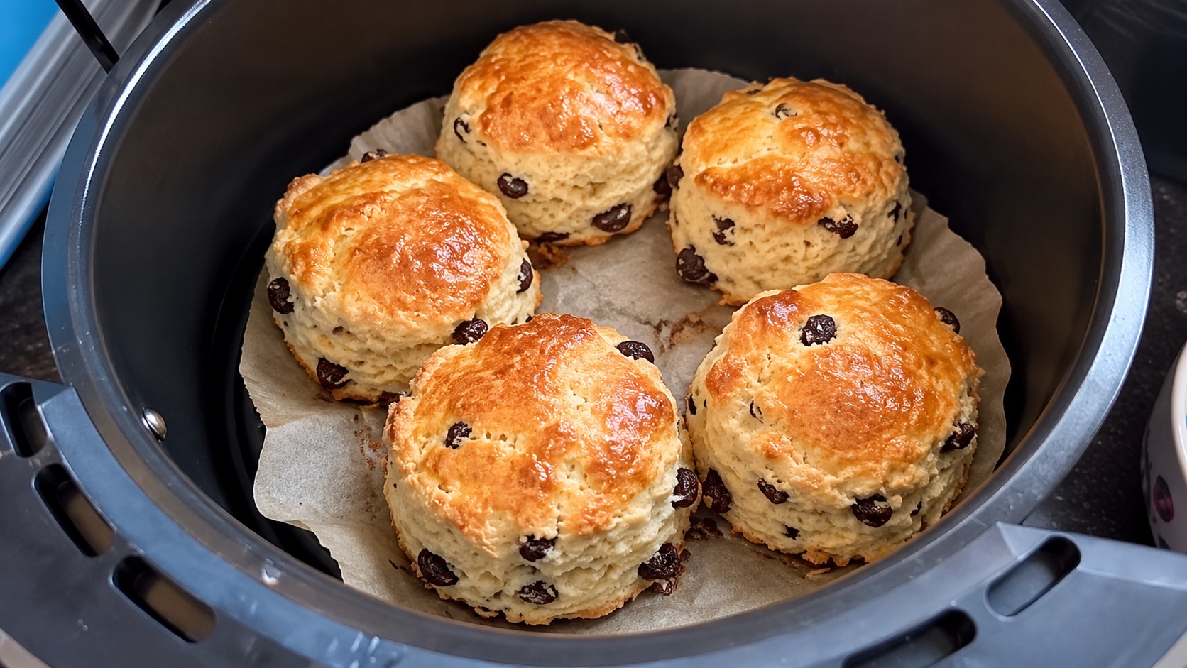 Make delicious air fryer fruit scones with this easy recipe. Light, fluffy and golden, they're perfect with a cup of tea or a little jam.
